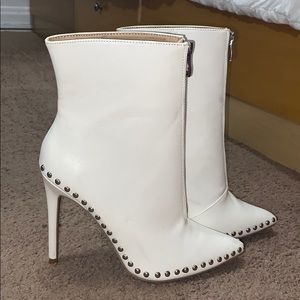 White, studded booties with silver detailing